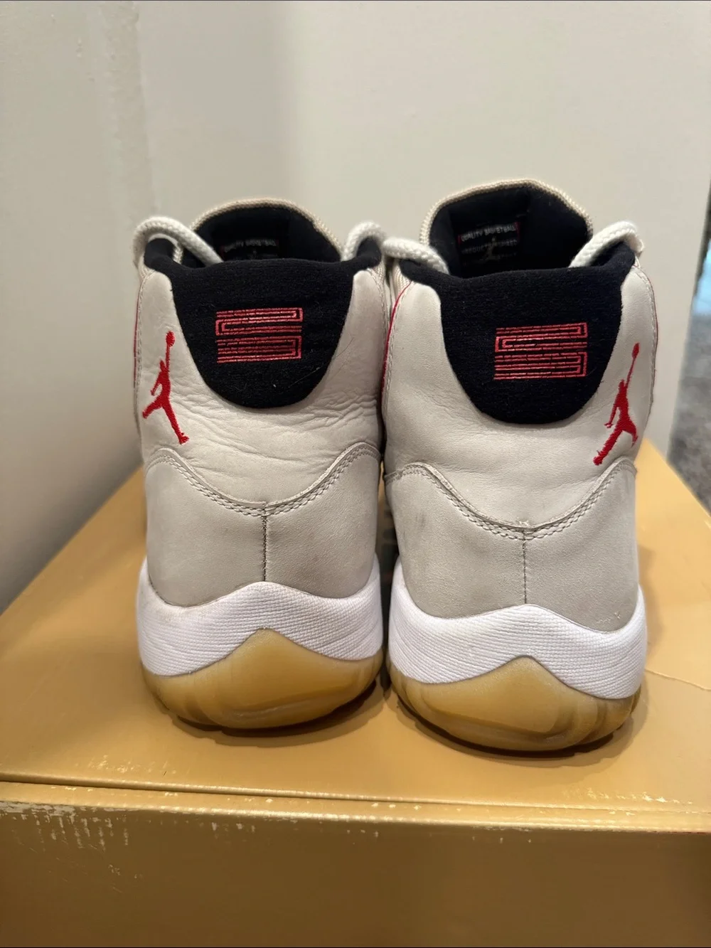 Jordan 11 Men's High-Top Sneakers in Off-White, Gum & Red Accents